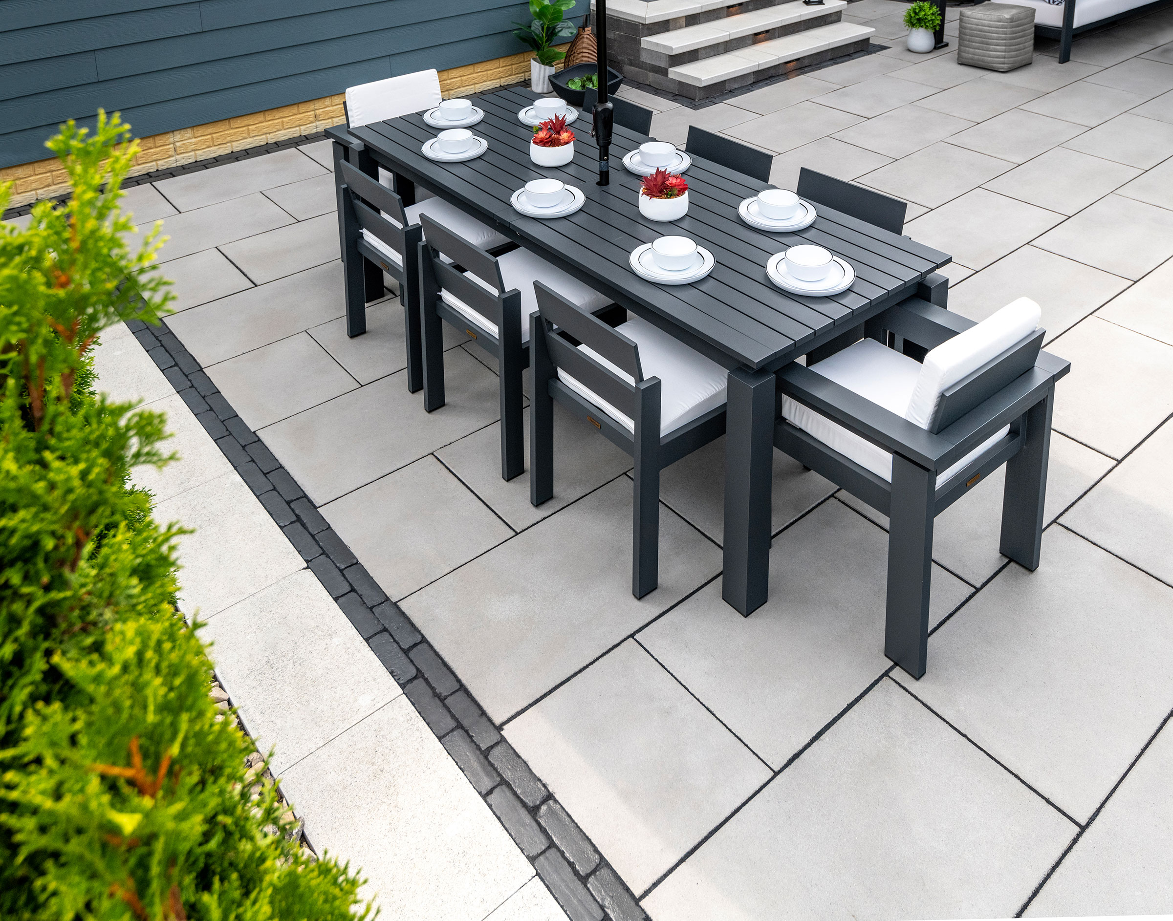 Modern dining set on porcelain paver patio